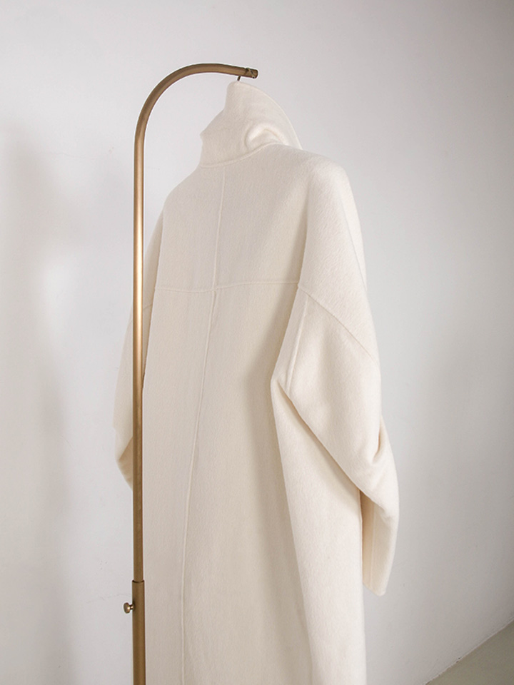 luxury frame edition coat close-up