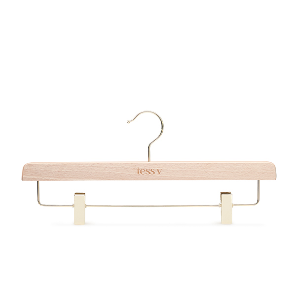 Wooden bottom hanger made from FSC beechwood with natural finish, gold metal parts and laser logo for Tess V